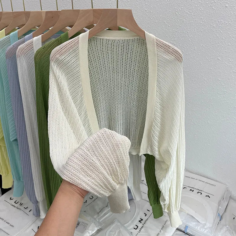 Women's white linen-look blouse with lantern sleeves and hollow-out detail, long sleeve