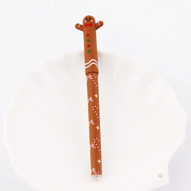 Four Christmas-themed erasable gel pens with Santa, gingerbread man, elk, and snowman designs on a white background