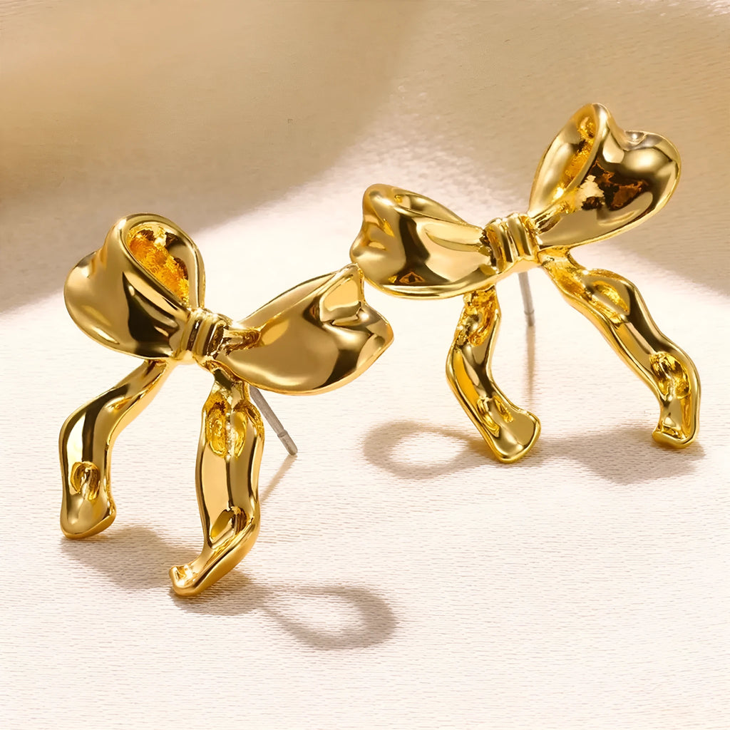 Pair of bow earrings in simple style, alloy with electroplated gold or silver finish