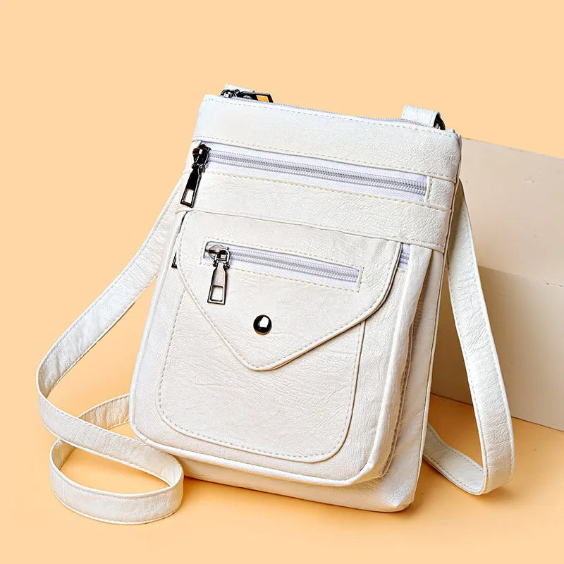 Vertical crossbody mobile phone bag in square shape with sewing line details