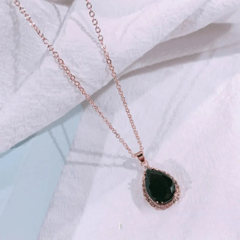 Rose gold water drop necklace with geometric rhinestones in pink colour