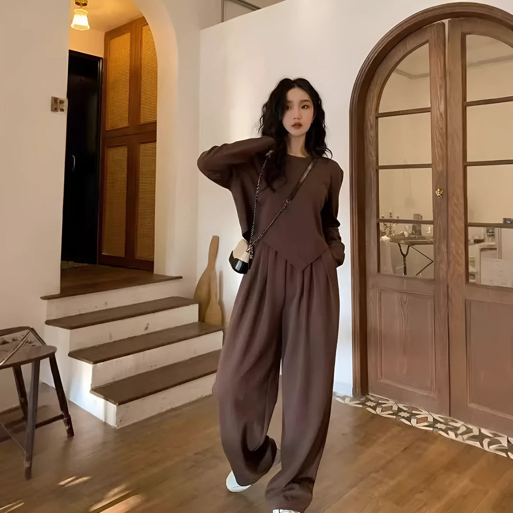 Women's khaki casual sports suit set with long sleeve top and trousers on a hanger