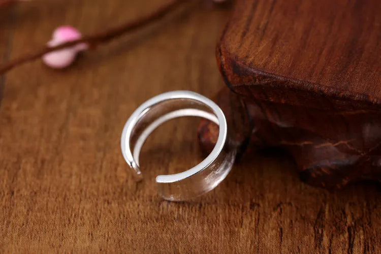 Adjustable open ring with geometric design and frosted sterling silver finish