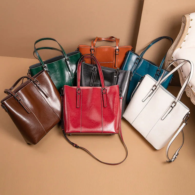 Brown genuine leather retro women's shoulder bag with three straps showing interior organisation compartments
