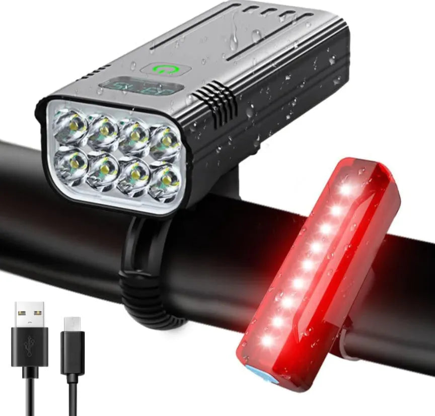 Black KX12DF digital display bicycle headlight on a 360-degree rotating mount with USB cable.