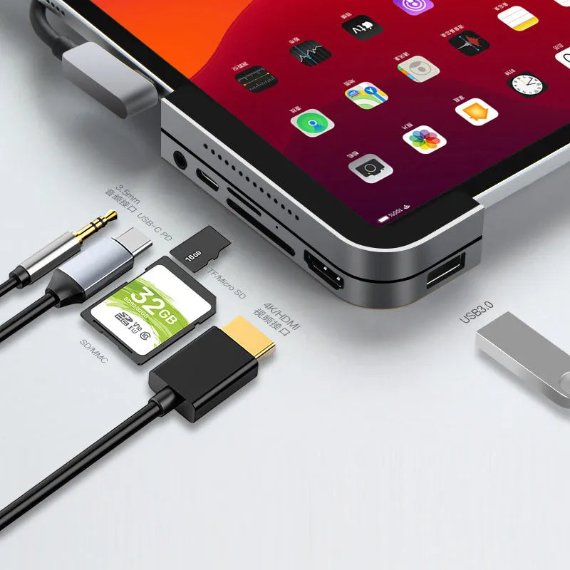 Silver aluminium grey USB-C 6-in-1 docking station for iPad Pro, showing HDMI port and card reader slots.