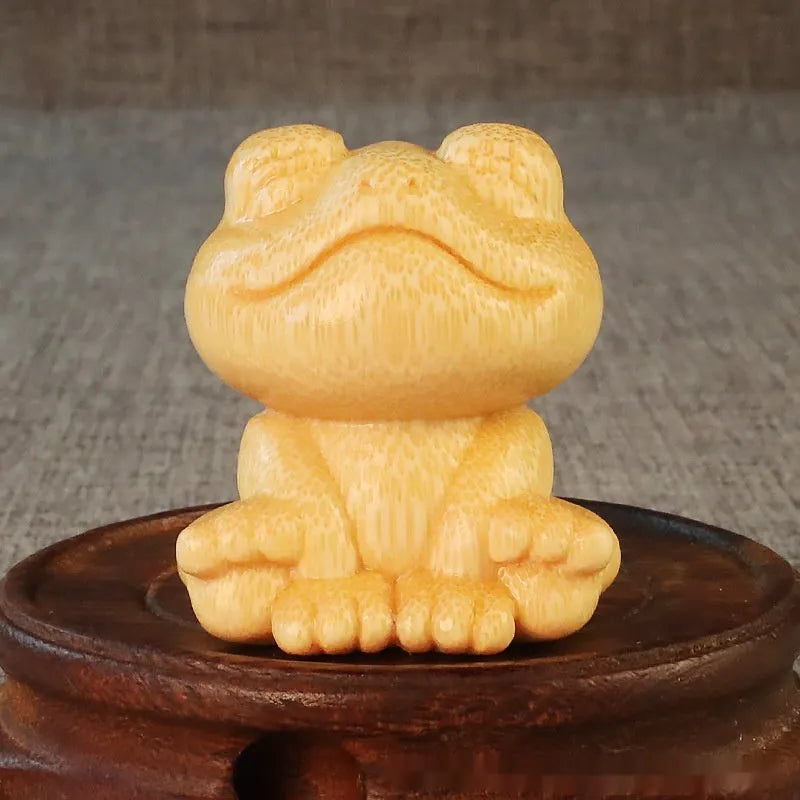 Solid bamboo carving ornament with smiling frog design measuring 5cm height