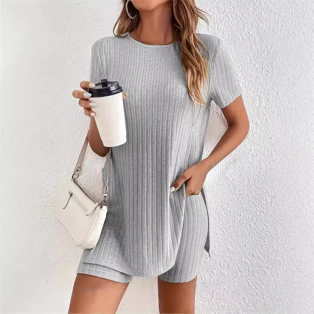 Women's casual cotton shorts suit in black, featuring a crew neck top with half sleeves and matching ribbed shorts.
