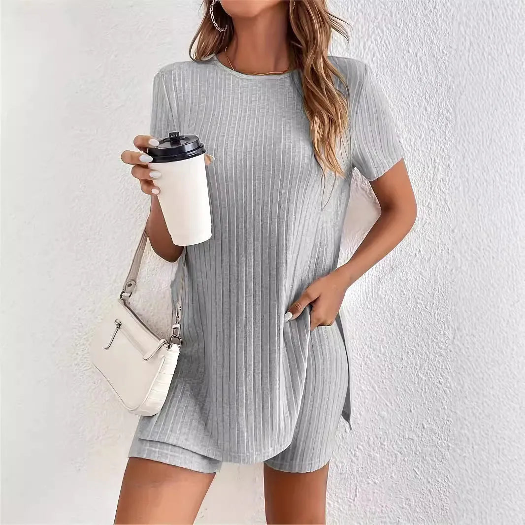 Women's casual cotton shorts suit in black, featuring a crew neck top with half sleeves and matching ribbed shorts.