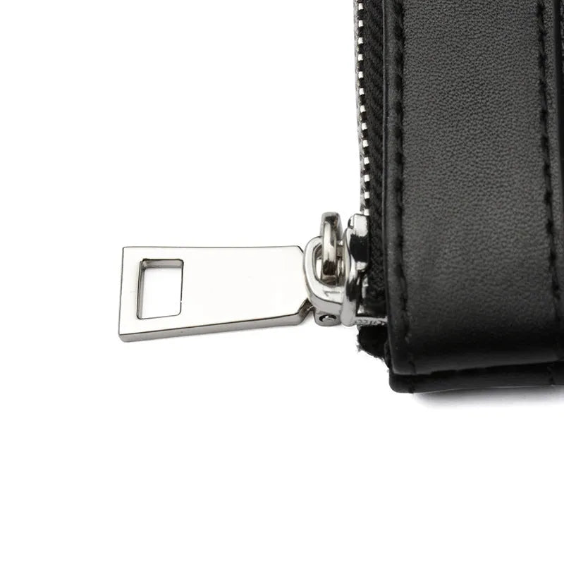 Men's black genuine leather clutch wallet showing front pocket profile and interior polyester lining