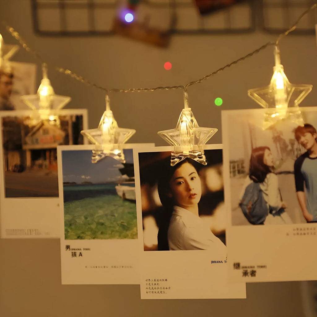 LED star clip festoon lights on a dark background showing warm white 3-metre string with 20 star-shaped lamps