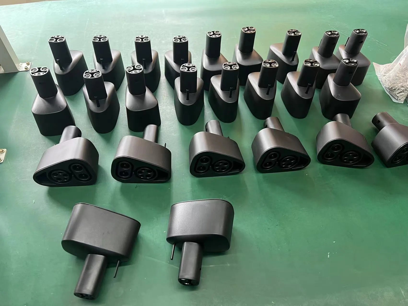 Black Tesla charging plug conversion adapter with dimensions 195mm by 96mm by 67mm