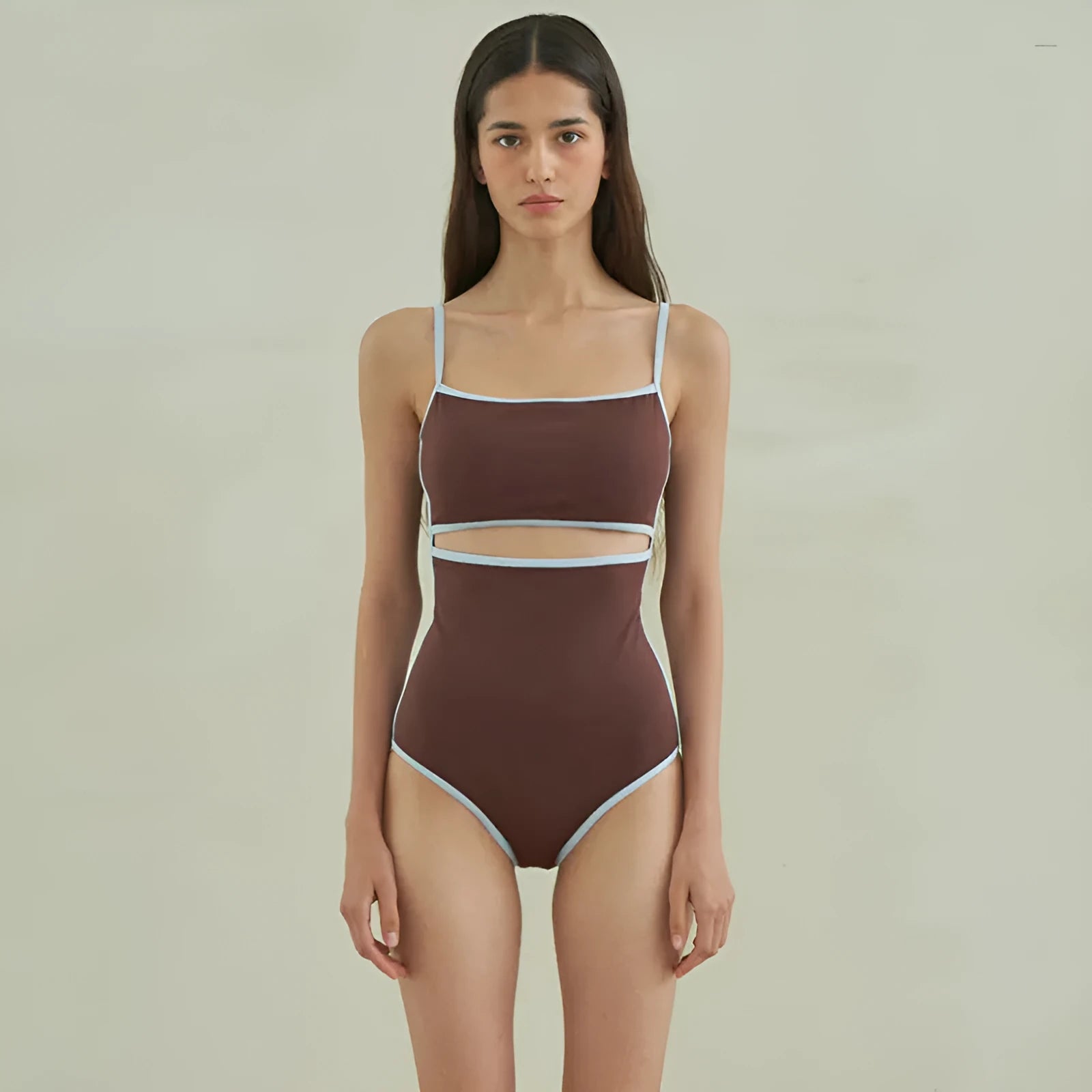 Brown nylon triangle one-piece swimsuit for women on a hanger