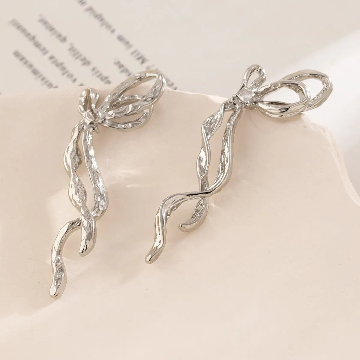 Bowknot earrings for women, alloy with electroplated White K finish, stud style, approximately 2.5cm width