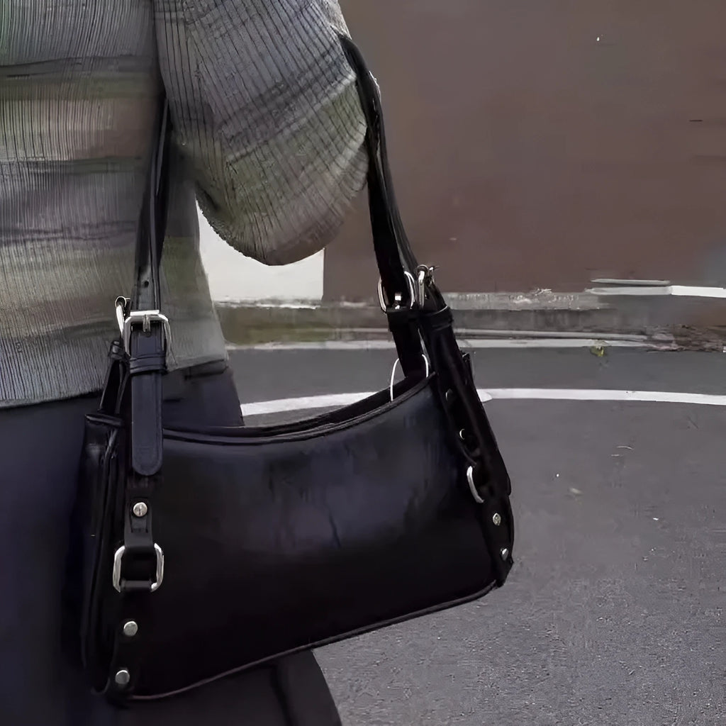 Black PU shoulder bag with horizontal square shape, outer three-dimensional pocket, and internal zipper change bag.