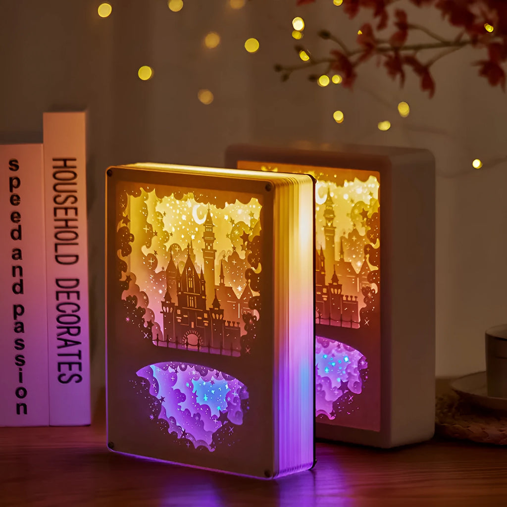ABS frame bedside night light with 3D paper carving design and remote control on a table.