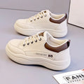 Women's white Korean-style leather pumps with cross straps and a 3-5cm mid heel on a rubber sole.