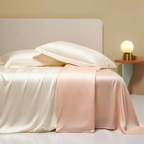 200 thread count Lenzing Tencel quilt cover and sheet set in Aurora Blue, laid on a bed.