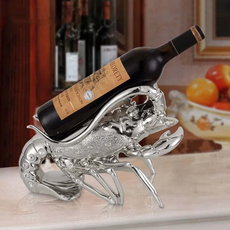 Lobster-shaped wine rack ornament in rose gold or silver holding a wine bottle