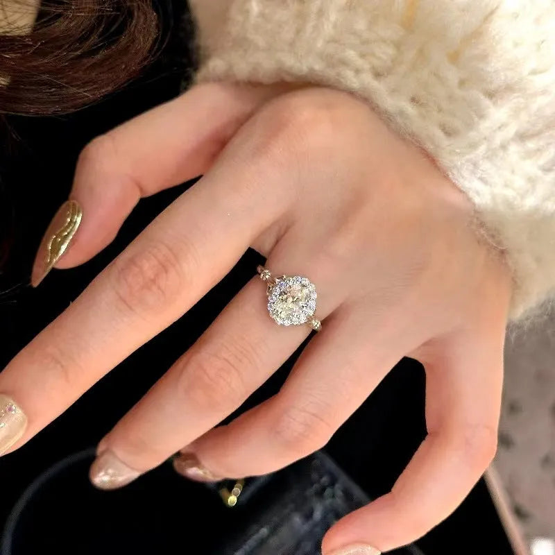 Adjustable silver geometric ellipse bridal bouquet ring with diamond surface treatment