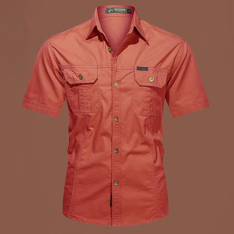 Men's loose fit cotton work shirt in army green with short sleeves and button front.
