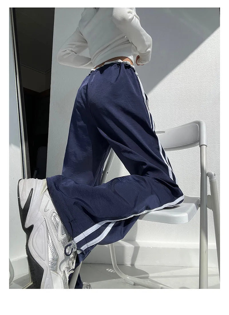Women's loose straight-leg trousers with contrast ribbon parallel bars detail in navy blue