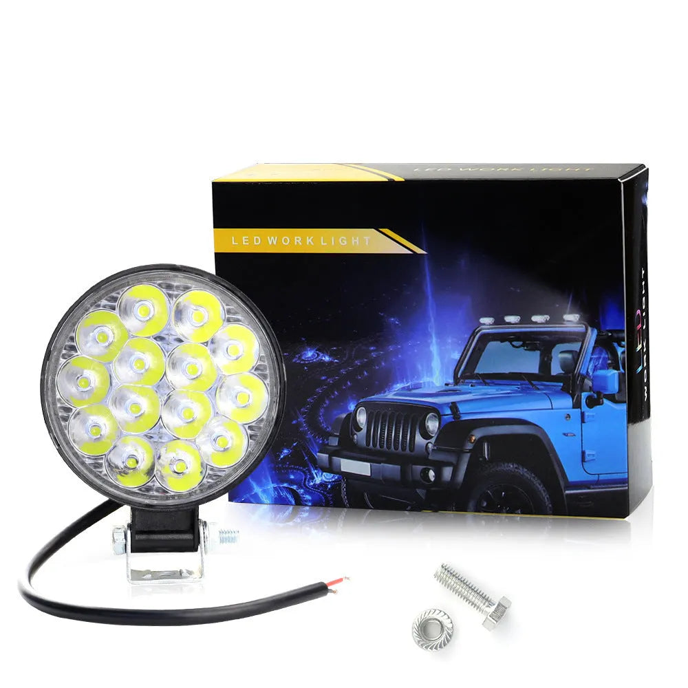 Round white LED work light with aluminium housing for vehicle mounting
