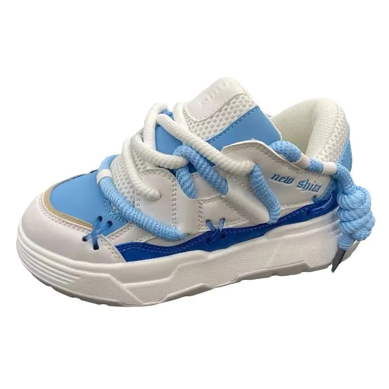 Women's grey retro chunky platform sneakers with a thick rubber sole and lace-up front.