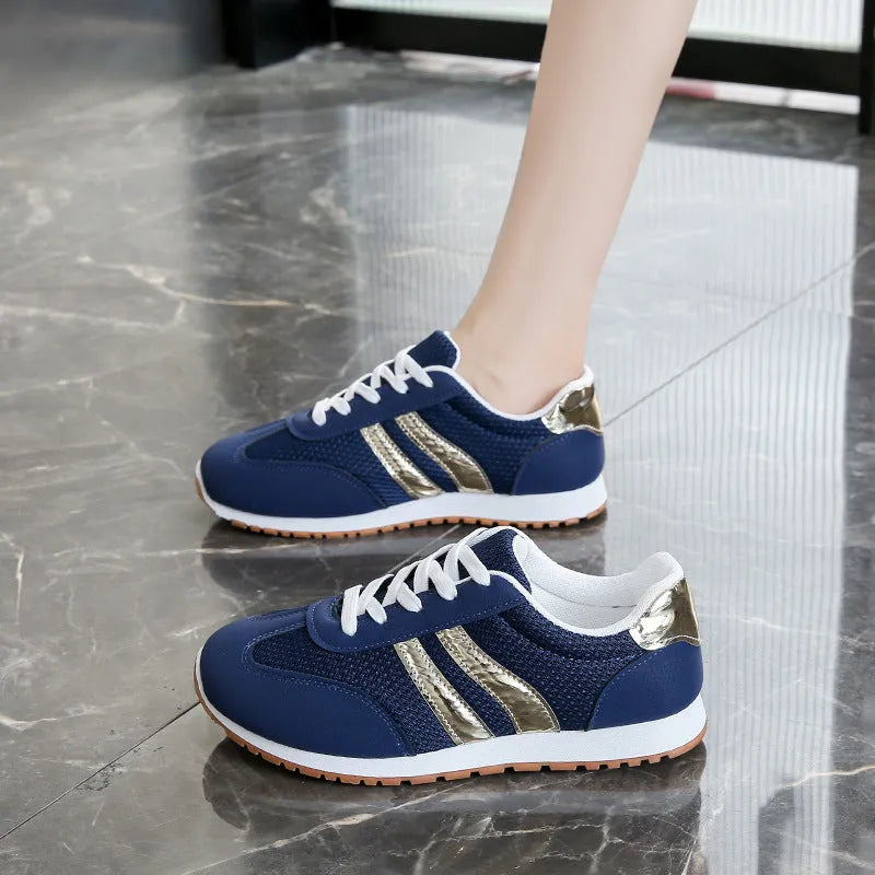 Blue women's casual tennis shoes with cross straps and non-slip rubber sole