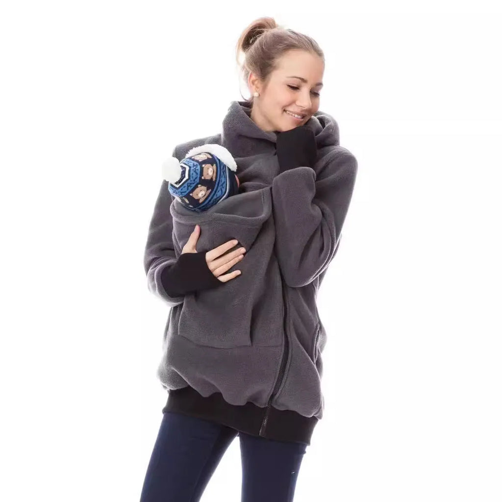 Red loose-fit women's polar fleece jumper with long sleeves on a hanger.