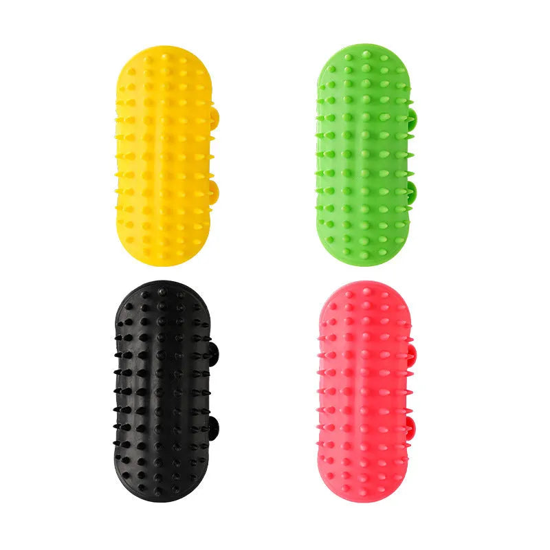 Silicone cat grooming massage comb with adjustable strap mounted on furniture leg