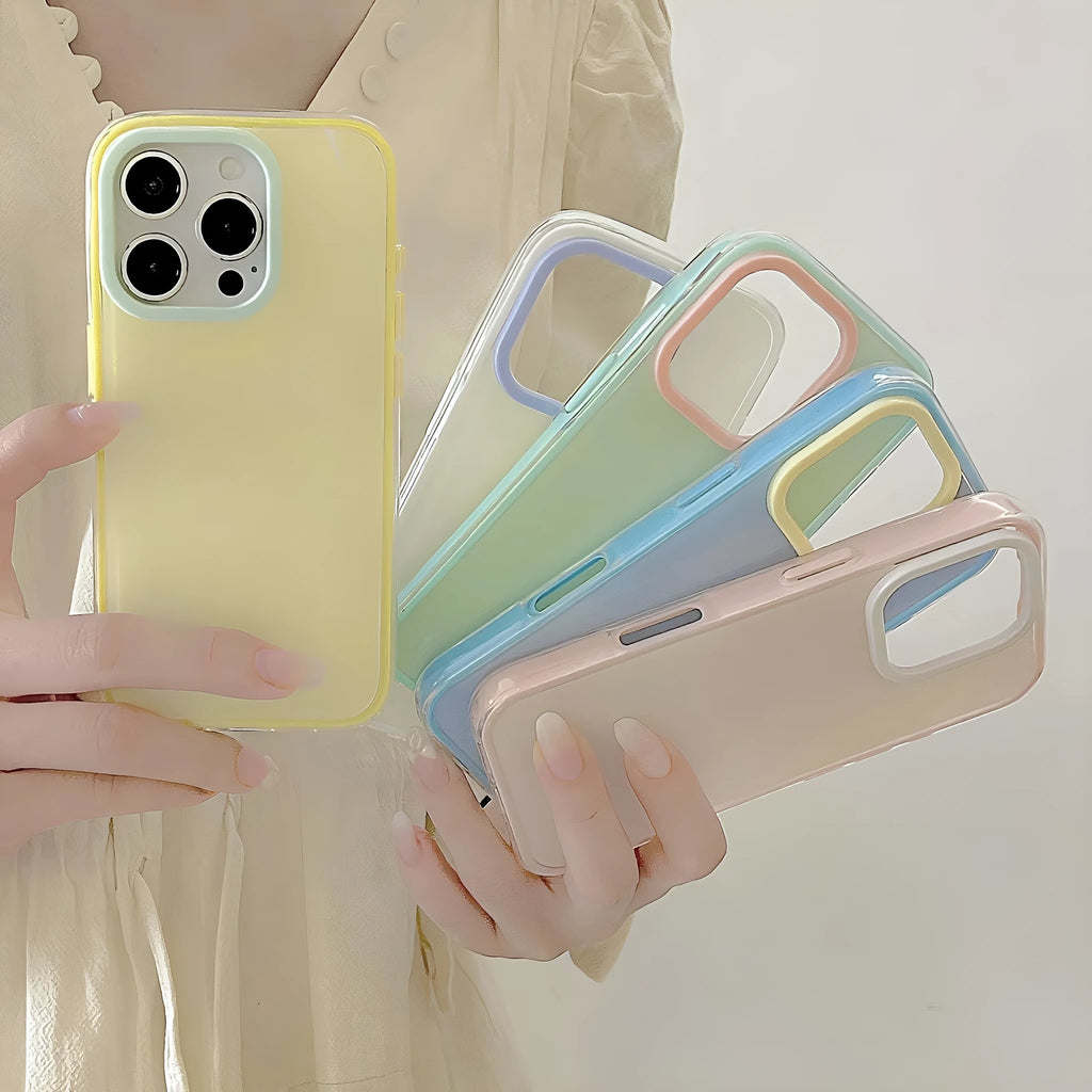 Simple solid colour jelly TPU phone case for iPhone, shown in blue, white and yellow.
