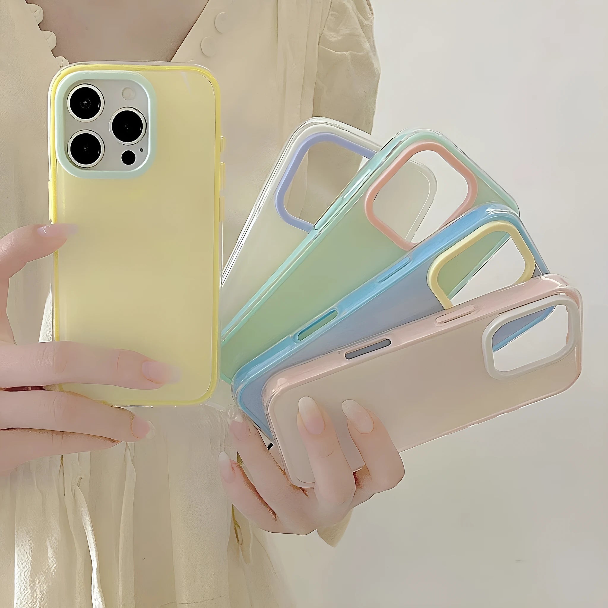 Simple solid colour jelly TPU phone case for iPhone, shown in blue, white and yellow.
