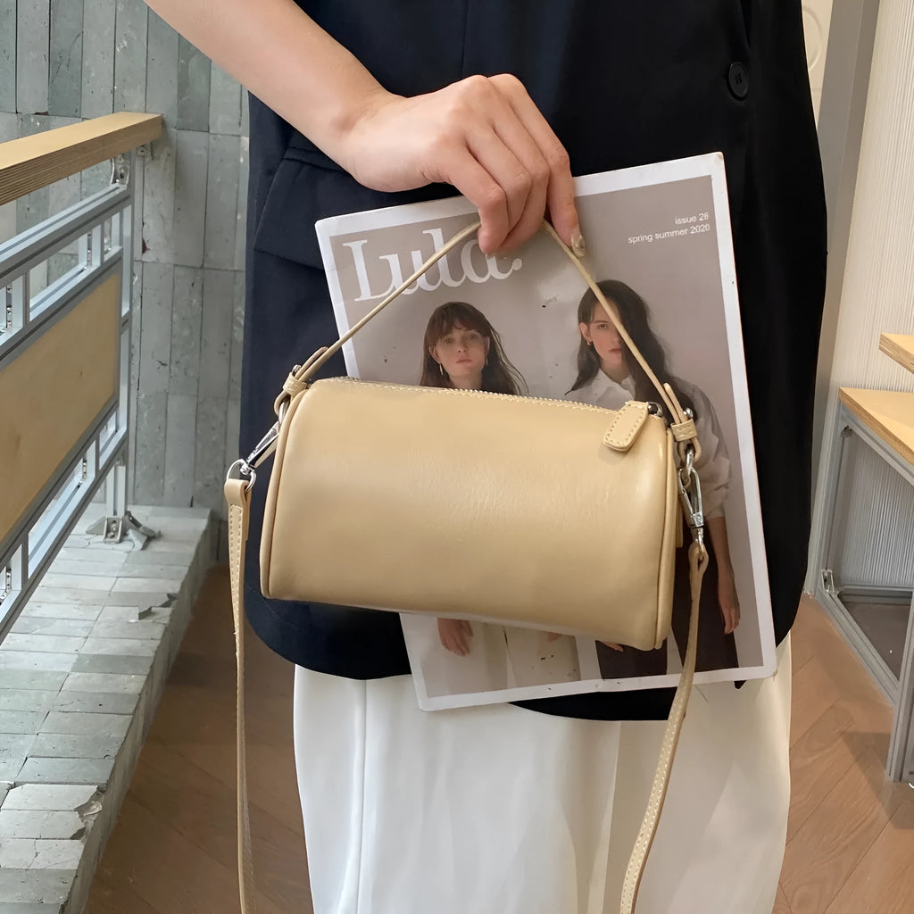 Soft vegetable tanning leather cylindrical crossbody phone bag in six colour options on a white background.