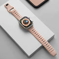 Fluoro rubber Apple Watch replacement strap with T buckle in one of six colours on a wrist.