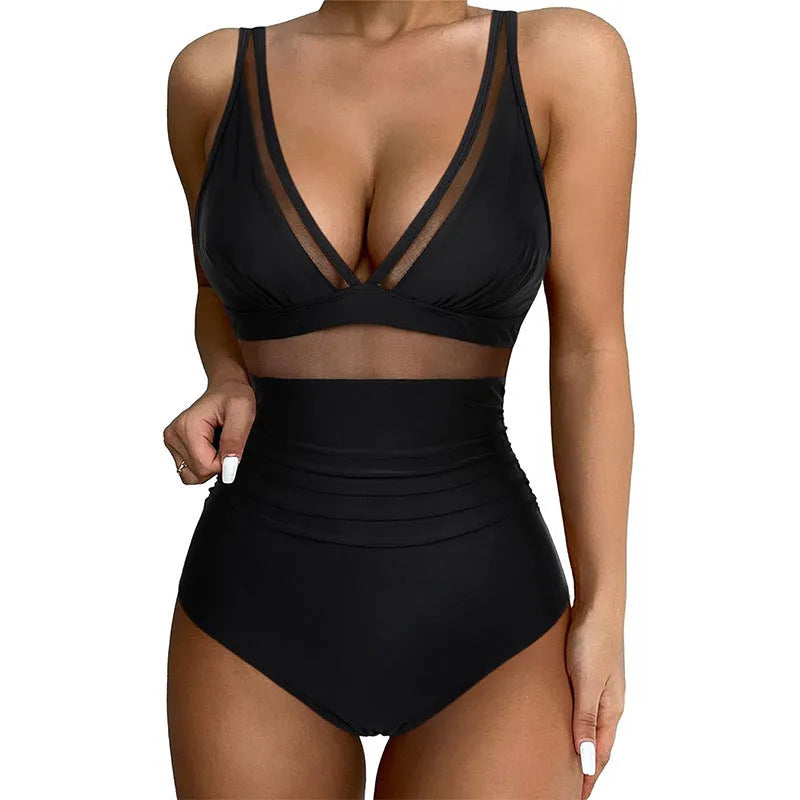 Black women's halter neck one-piece swimsuit with cross-back straps and briefs bottom.