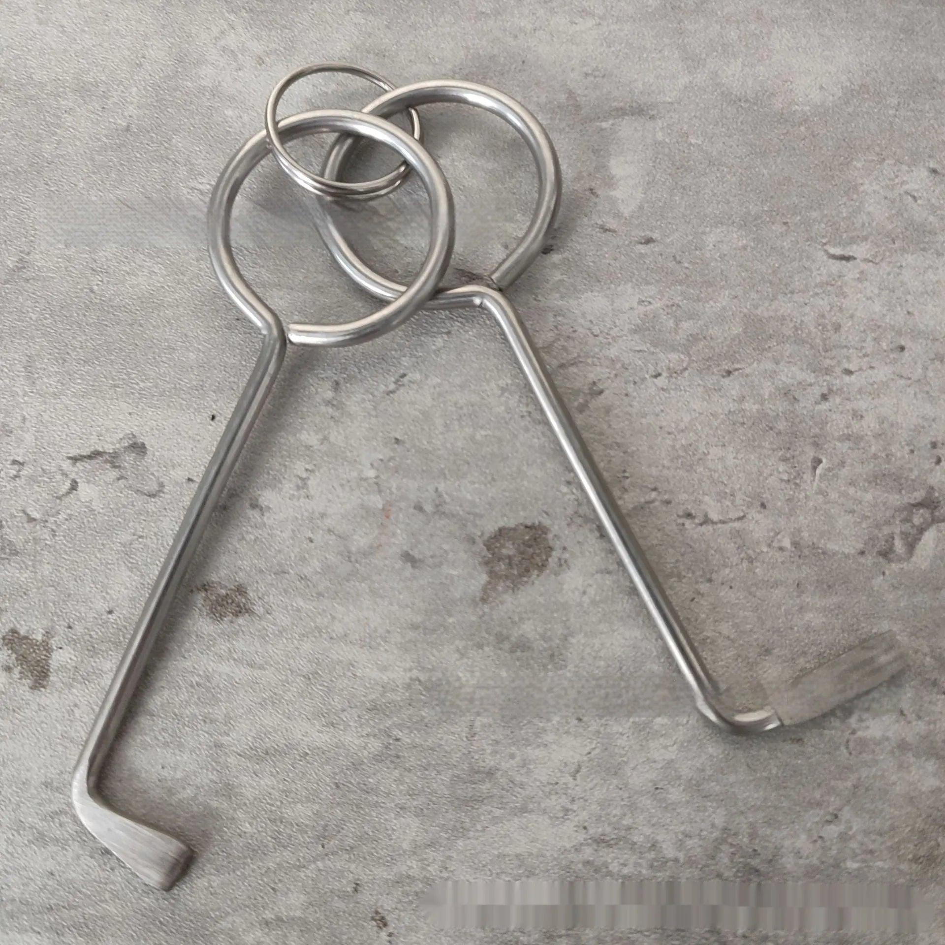 Two alloy steel wrench tools from a portable set for universal household and automotive use.