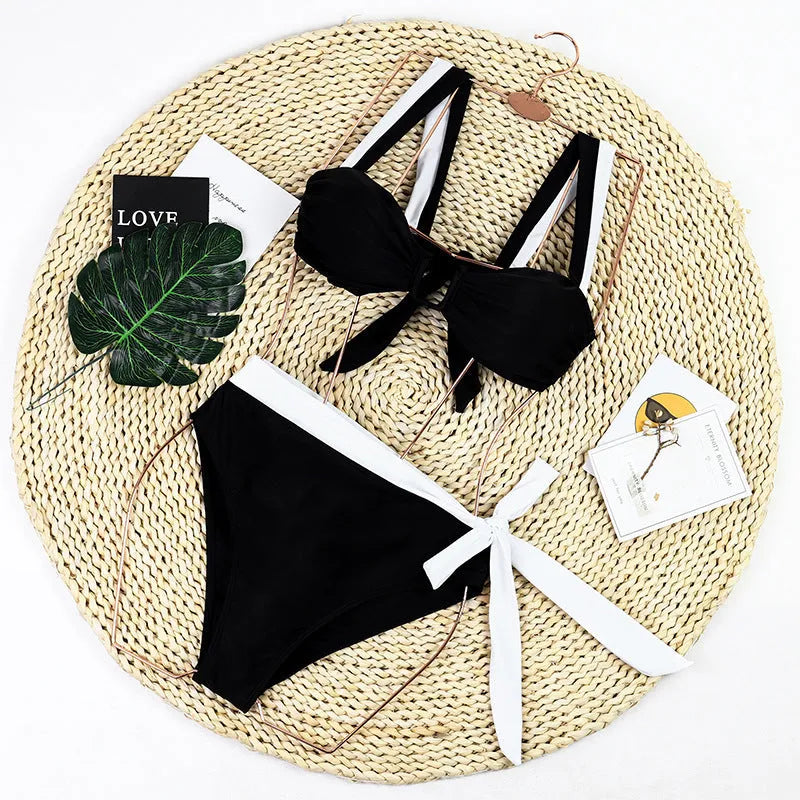 Black high-waist bikini swimsuit set with stitched construction on a mannequin