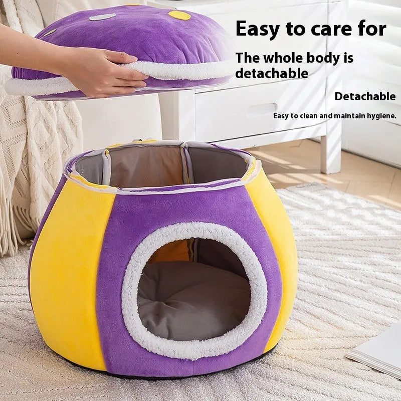 Grey mushroom-shaped plush cat bed on a wooden floor