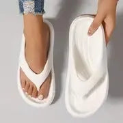 Women's thick-soled EVA flip-flops in black, white or grey with non-slip patterned soles