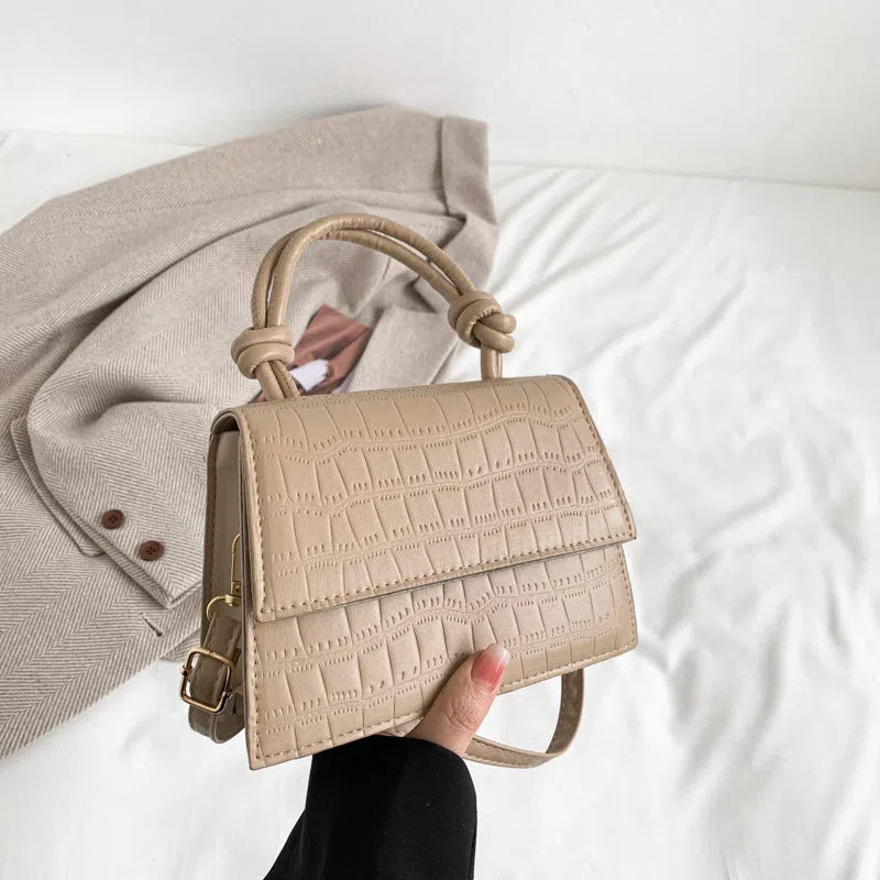 Women's soft PU underarm bag in horizontal rectangle shape with stitched seams and single shoulder strap