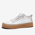 Men's black leather casual shoes with white soles and lace-up front.