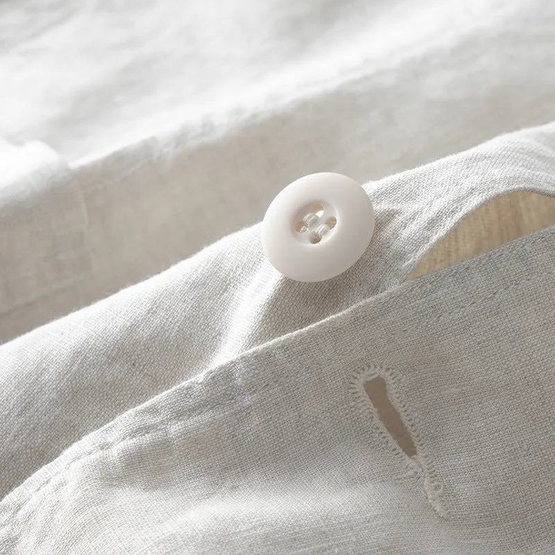 A man's casual linen suit jacket in a solid colour, shown with long sleeves and a loose fit.