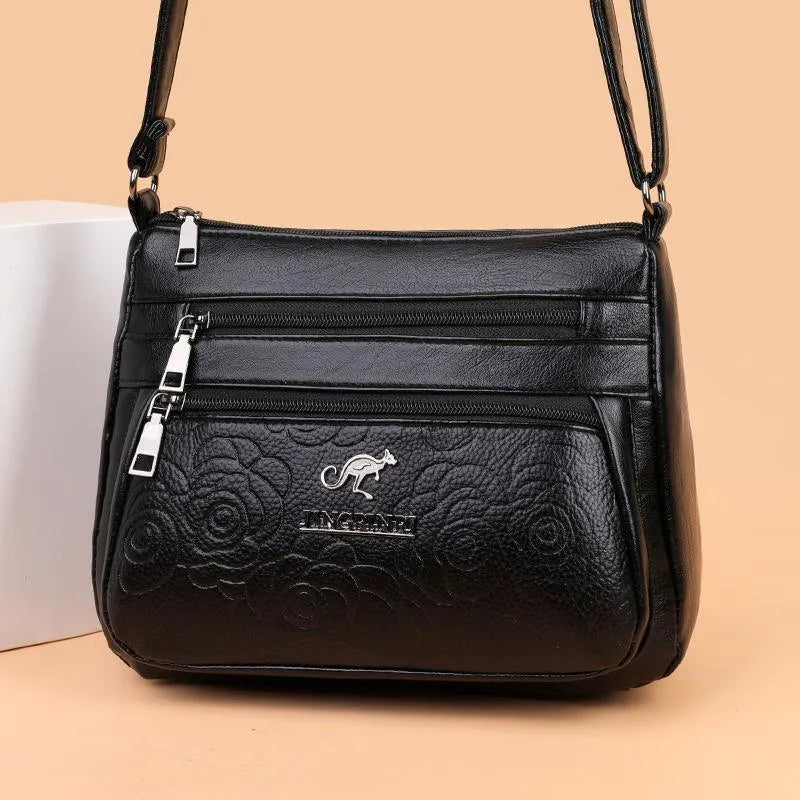 Black PU women's shoulder messenger bag with horizontal square shape, single strap, slit pocket, and phone bag