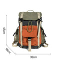 Orange and green contrast colour large nylon backpack with multiple compartments on a plain background.