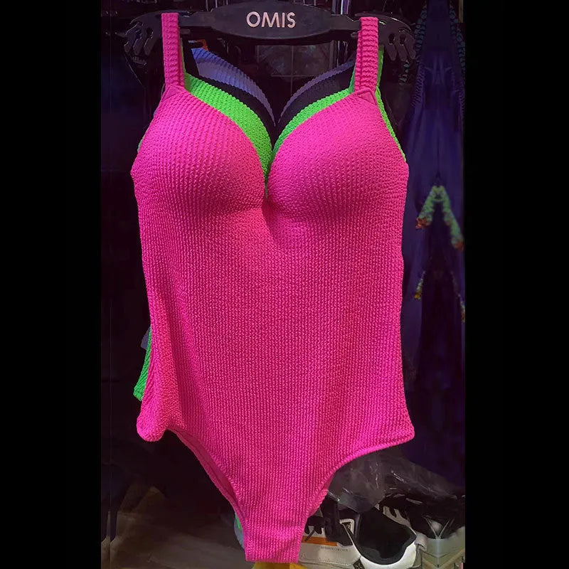 Women's black sleeveless one-piece swimsuit with sunkissed stripe detail on mannequin.