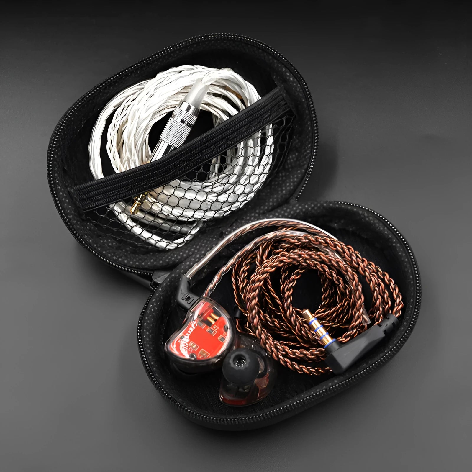 Black oval leather earphone storage bag compatible with EDX PRO and ZEX PRO earbuds.