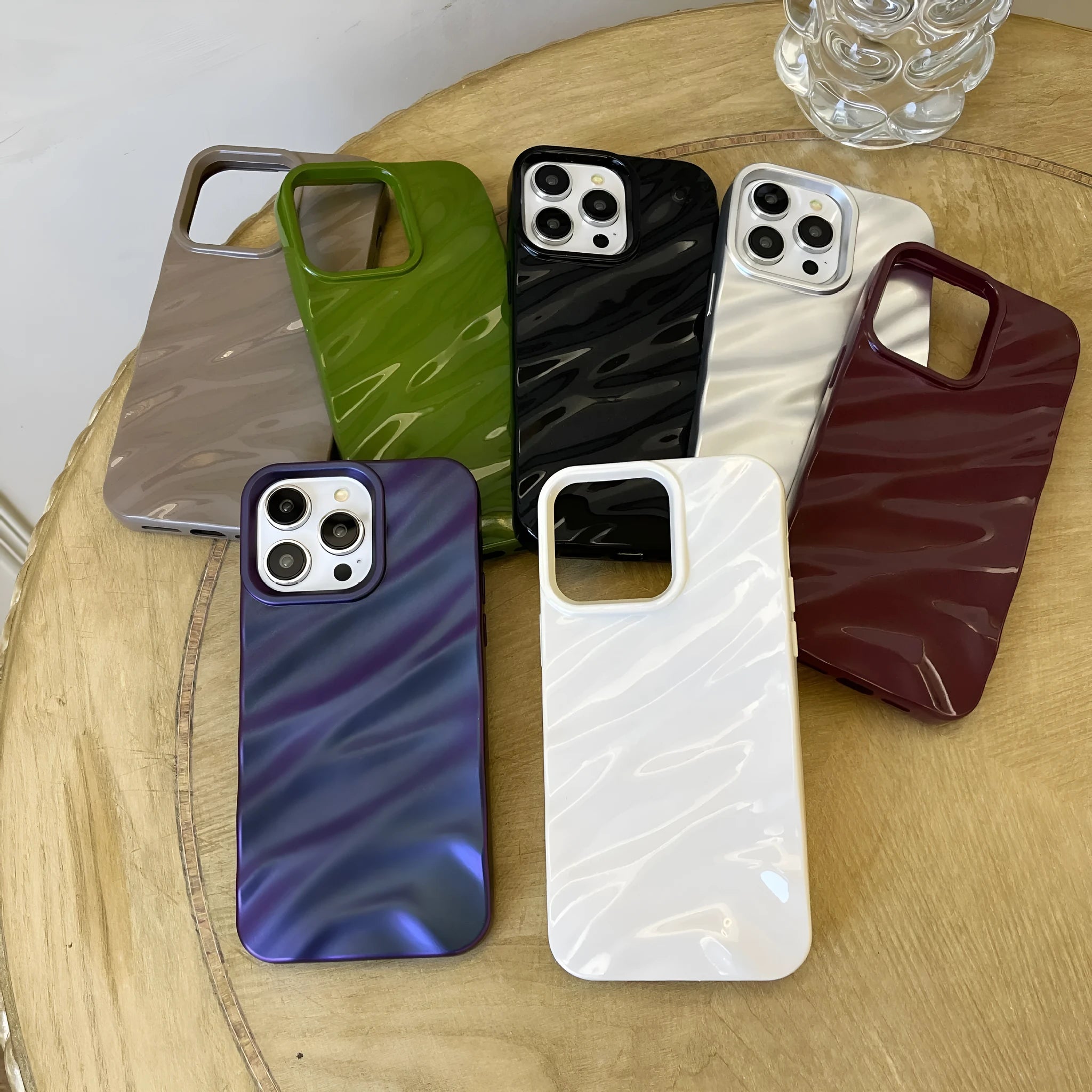 Soft solid colour wave pleated TPU protective case for Apple iPhone 17 series in burgundy on a white background.