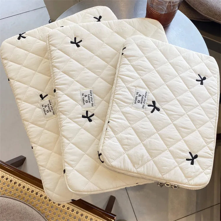 Embroidered rhombus bow detail on nylon laptop storage bag in light blue colour