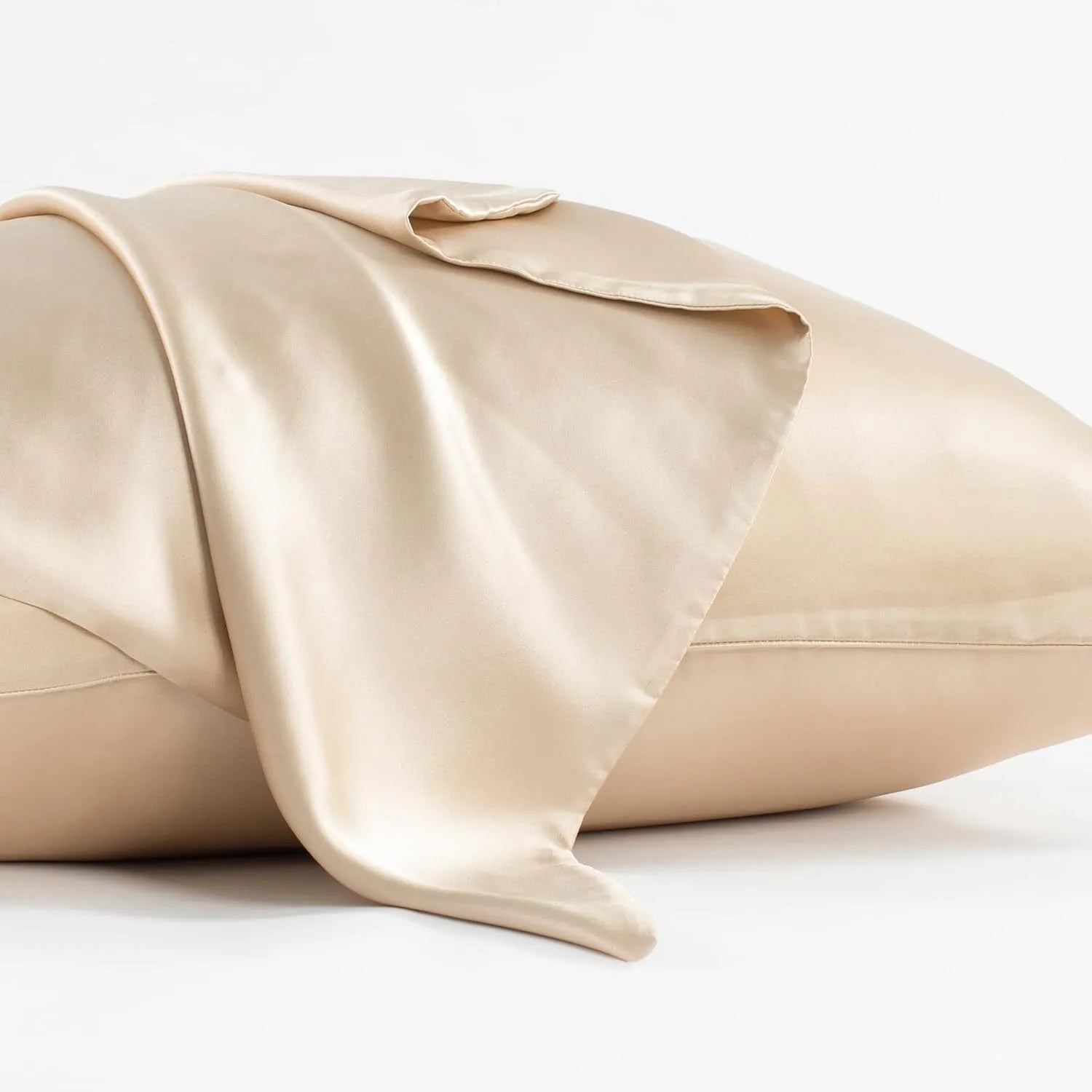 Dark grey silk pillowcase with envelope closure, shown in modern bedding setting.